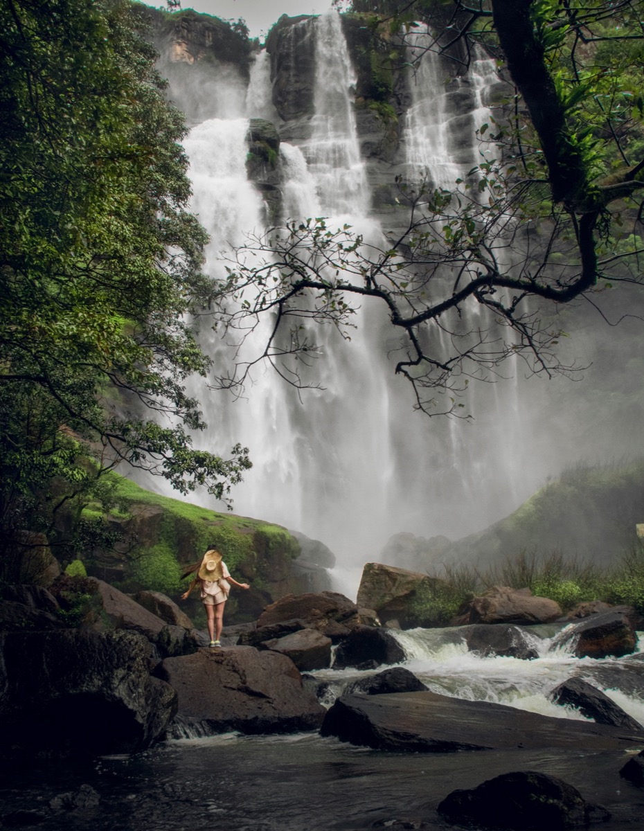 Waterfall surrounded by green hills